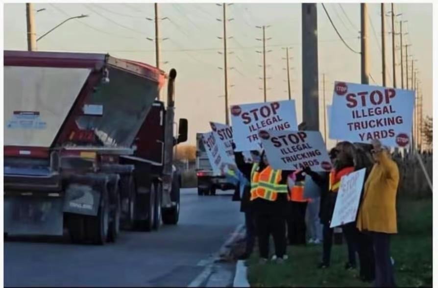 Community members protesting illegal trucking yards